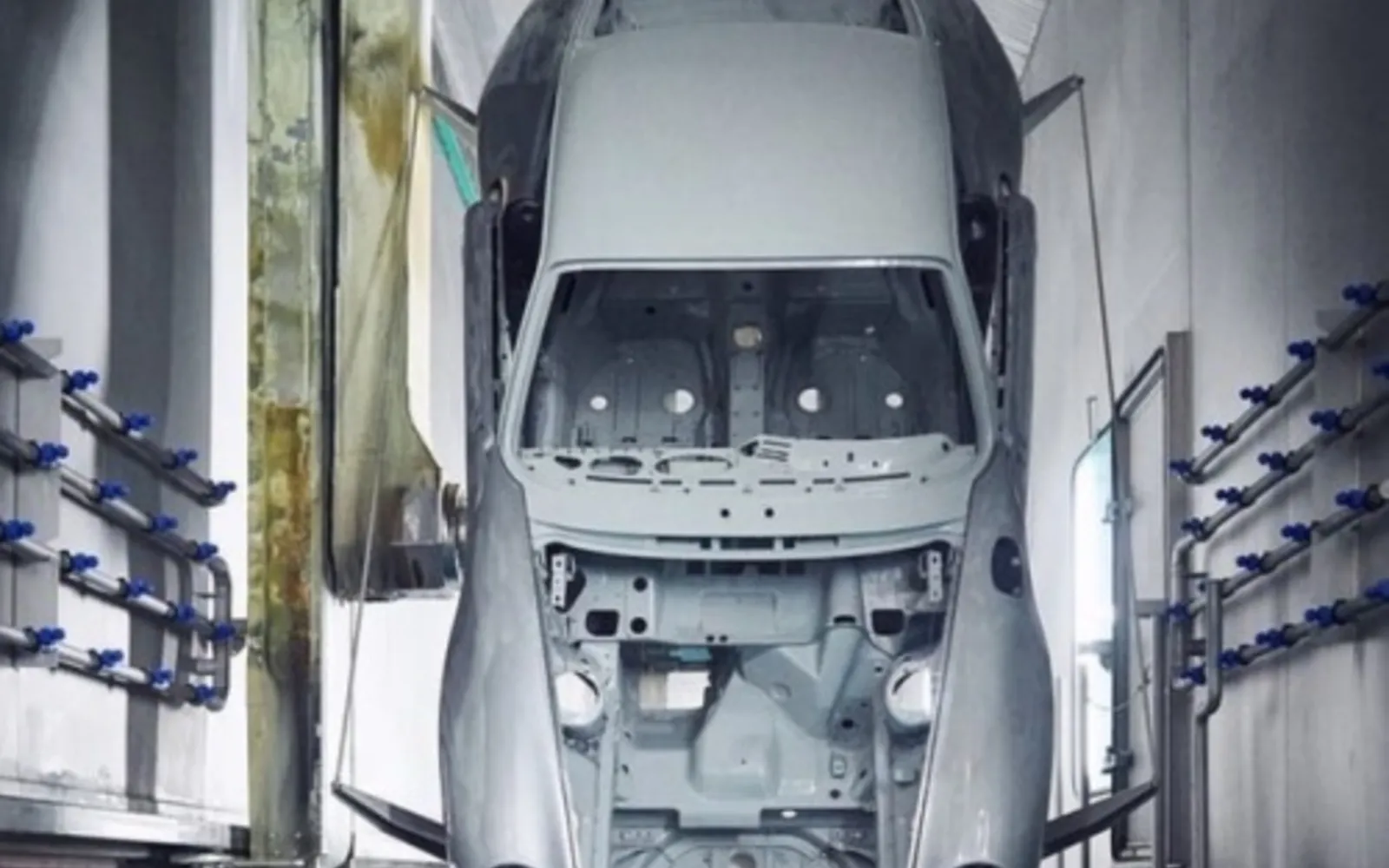 Vehicle body in a cathodic electro-deposition (CED) coating line