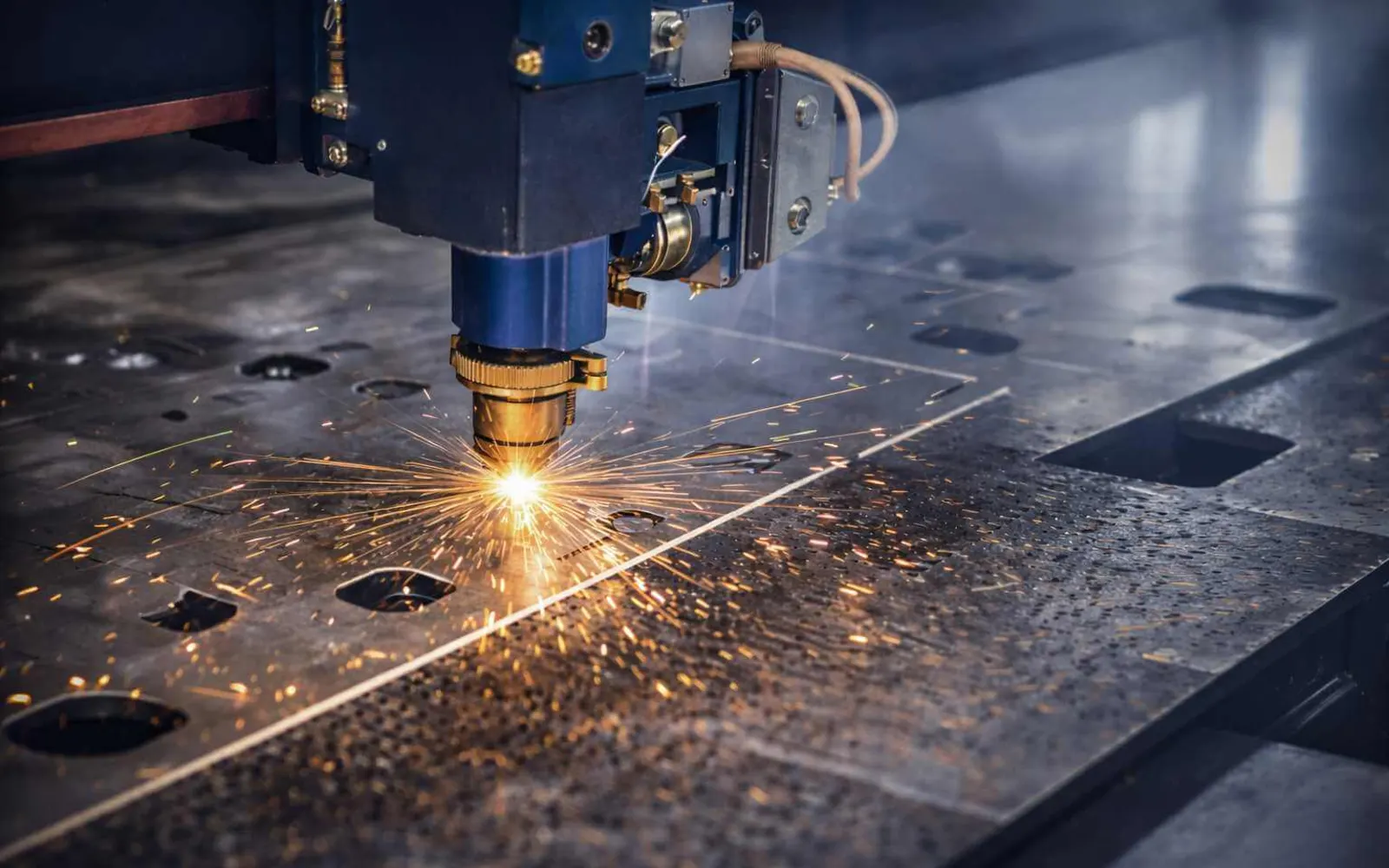 CNC fiber laser cutting a steel sheet at FabExpress Pune