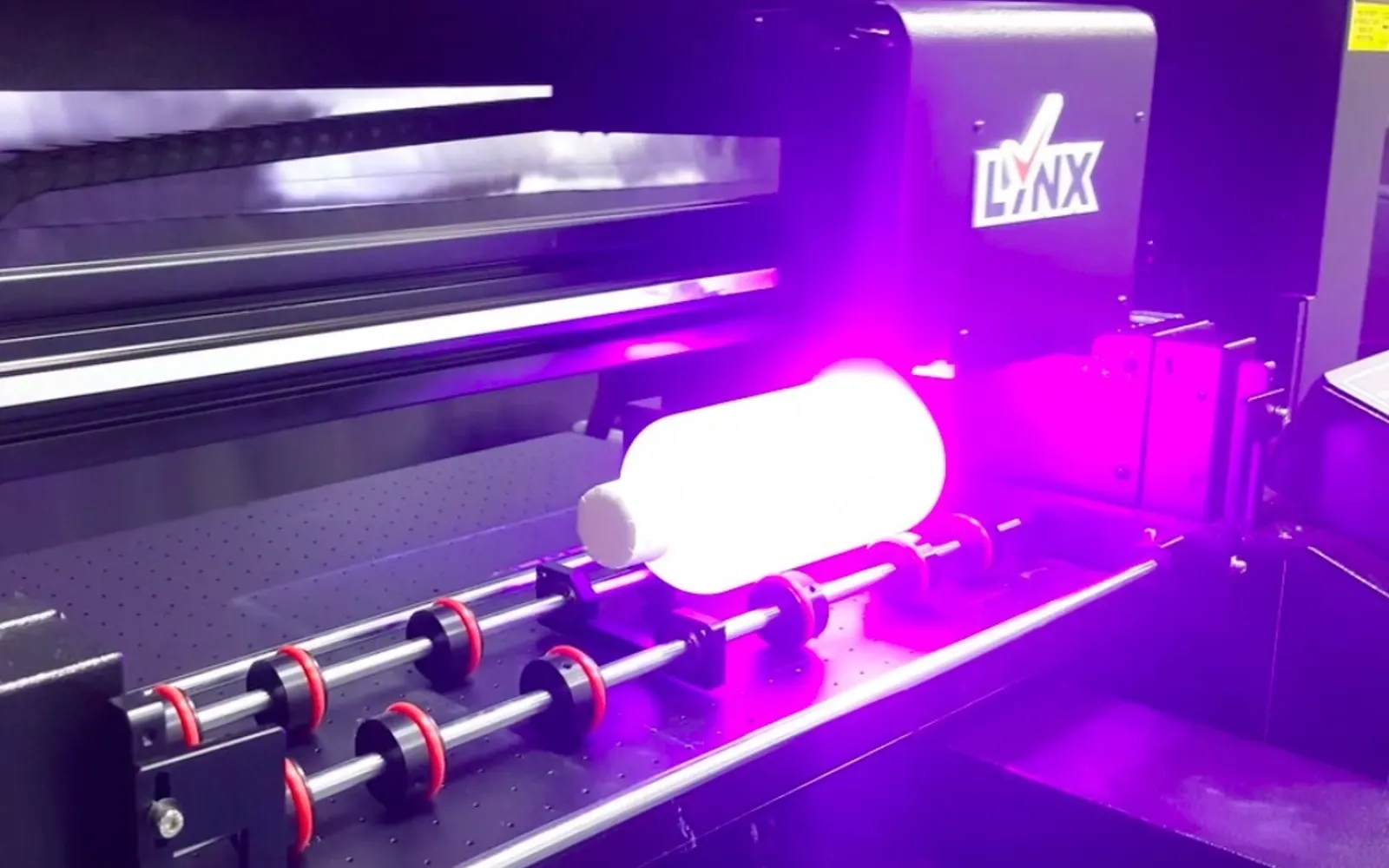 UV printer curing full-colour print on a rigid part